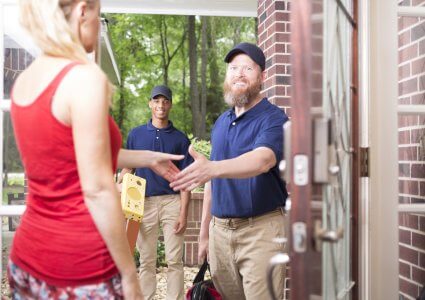 Workers arriving at a house for a home inspection
