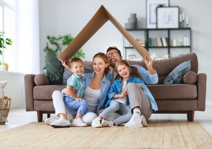 Happy family in their new home and neighborhood