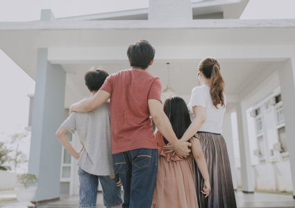 Family standing in front of home | home value Chester County