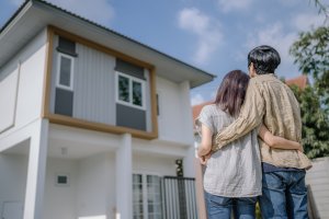 Young couple looking at their new move-in ready home